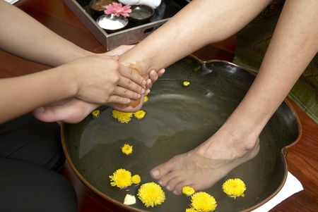 reflexology foot massage, spa foot treatment by hand herb,Thailandの写真素材