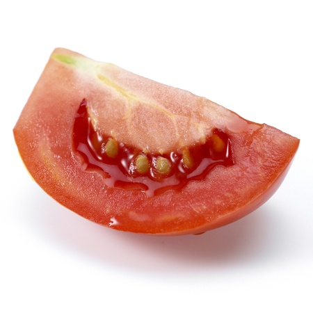 Tomato and slices of tomato on white backgroundの写真素材