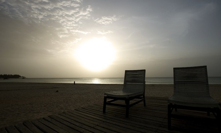 Sunset over the tropical beachの写真素材