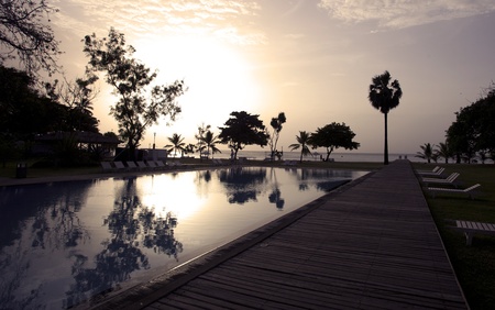 Sunset at a beach resort in the tropics.の写真素材
