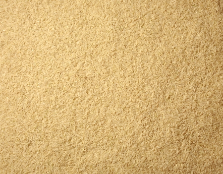 Brown long rice background, uncooked raw cereals, macro closeupの写真素材