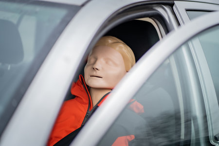 Resuscitation model is sitting on the seat of the driver ready for another medical simulation during...