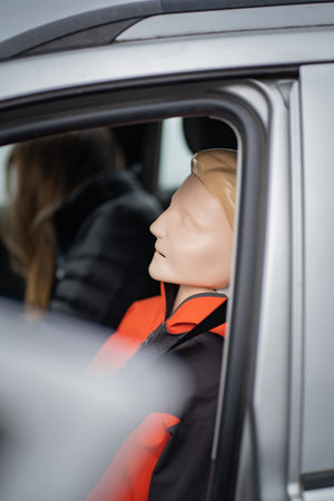 Resuscitation model is sitting on the seat of the driver ready for another medical simulation during...