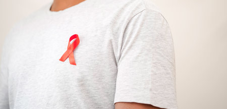 Worlds HIV AIDS Day, 1 December, Health Concept, Men Wearing HIV AIDS Badge to spread HIV AIDS...
