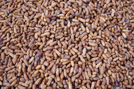 Close up of peanut or groundnut Unpeeled selling in market in india, Peanuts in bulk, market...