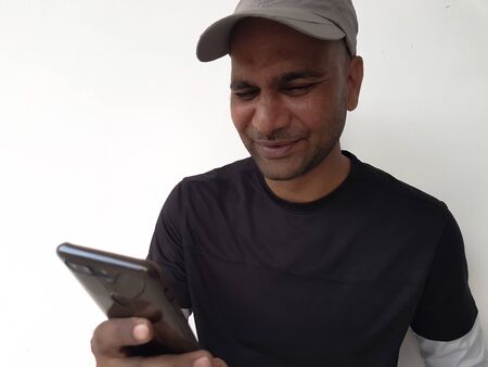 Indian man with mobile close up