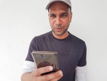 Indian man with mobile close up