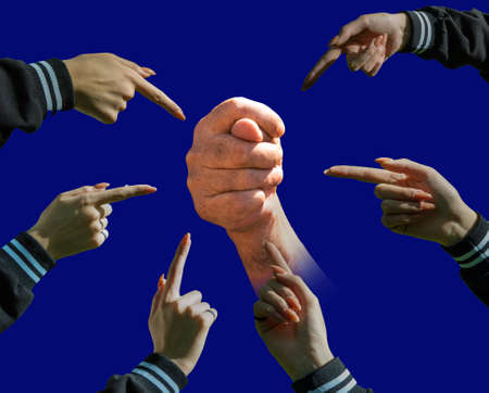 The female index fingers in the circle point to the fig man's finger. blue background.の写真素材