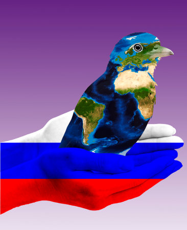 A bird with the texture of the globe. The hand of a man with the texture of the flag of Russia. The symbol of the power of the worldの写真素材