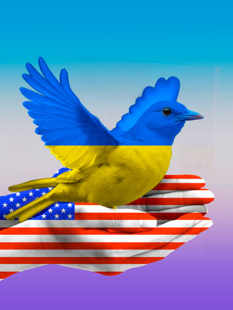 A man's hand with the texture of the US flag, a bird with the texture of the flag of Ukraine.の写真素材