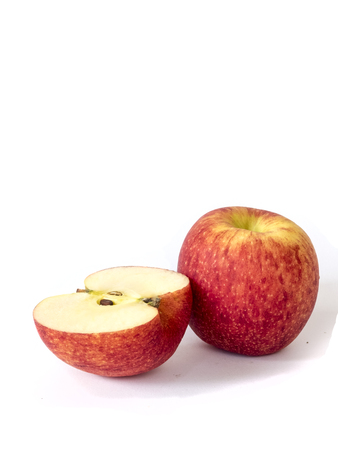 red fuji apple with half slice ,isolated on whiteの写真素材