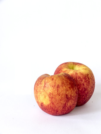 red fuji apple with half slice ,isolated on whiteの写真素材