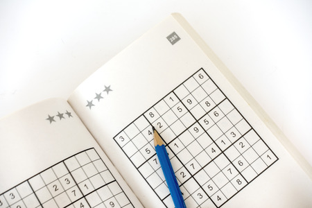 sudoku book isolated on white の写真素材