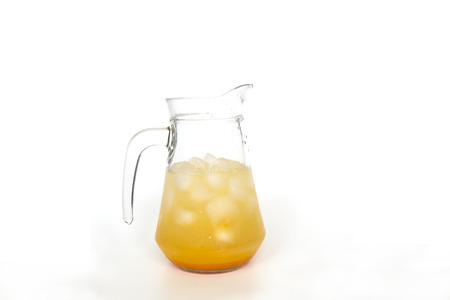 juice in the glass jar isolated on whiteの写真素材