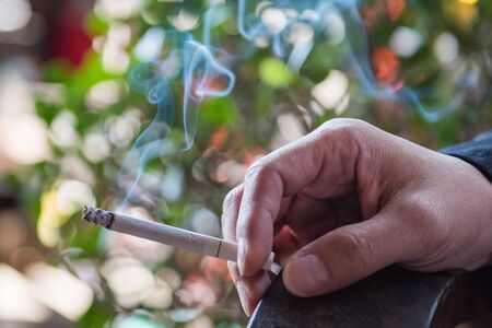 a man smokeing tabacco or cigarette. smoke tabacco and cigarette bad Healthの写真素材