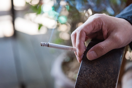 a man smokeing tabacco or cigarette. smoke tabacco and cigarette bad Healthの写真素材