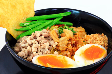 Close up Thai pork noodles with boiled eggの写真素材