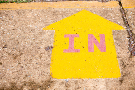 IN the yellow arrow. On the concreteの写真素材