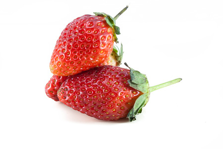 This is a fresh, bright red strawberry shot on a white background の写真素材