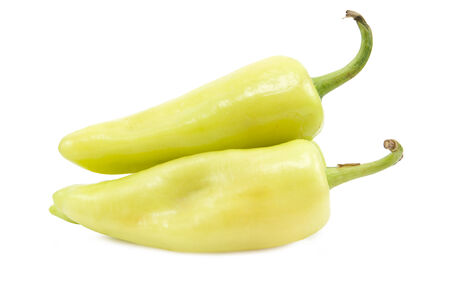 Two green pepper isolated on a white backgroundの写真素材