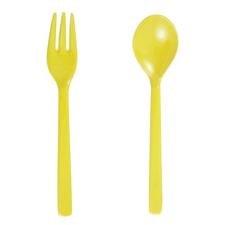 Yellow plastic  fork and spoon isolated on whiteの写真素材