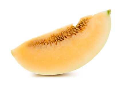 Cantaloupe wedges on a white background.の写真素材