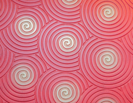 Red background with spiralsの写真素材