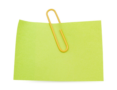 Green Note with yellow paper clip isolated clipping pathの写真素材