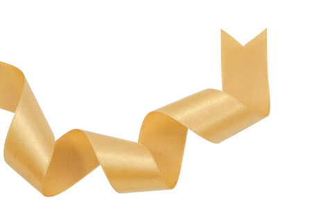 Gold ribbon nicely uncurled isolated on pure whiteの写真素材