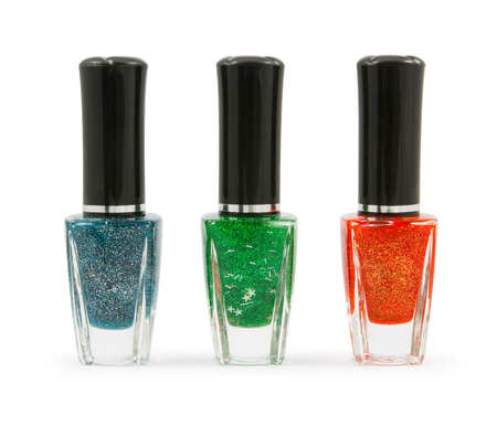 Green red  blue nail polish bottle on white backgroundの写真素材