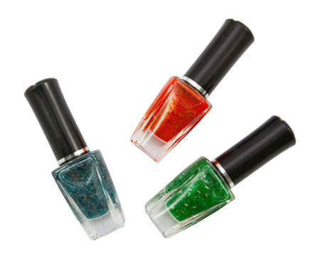 Green red  blue nail polish bottle on white backgroundの写真素材