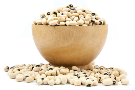 black eyed peas beans in wood cup isolated on a white backgroundの写真素材
