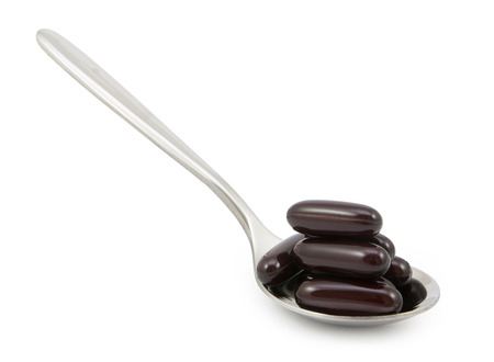 vitamin pills in spoonの写真素材