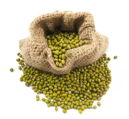 Green beans  in canvas sack on white backgroundの写真素材