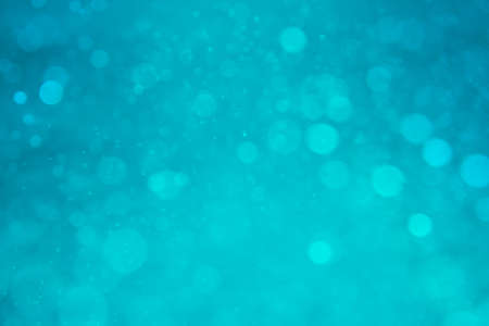 abstract circular green bokeh backgroundの写真素材