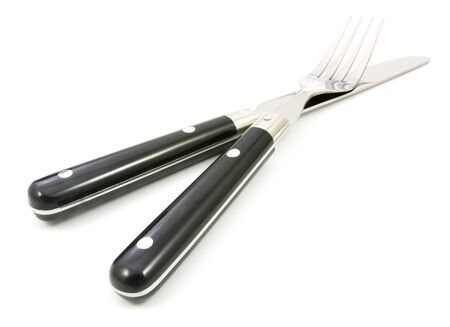 fork and knife isolated on whiteの写真素材