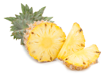 pineapple with slices isolated on whiteの写真素材