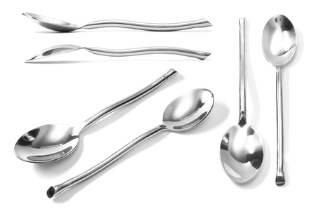 beautiful collection of Stainless steel glossy metal kitchen spoon isolatedの写真素材