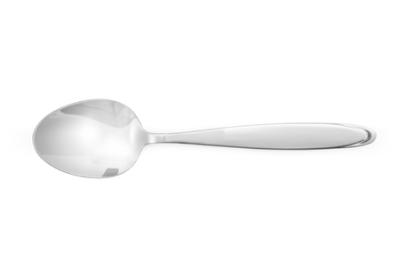Stainless steel glossy metal kitchen spoon isolated over the white backgroundの写真素材