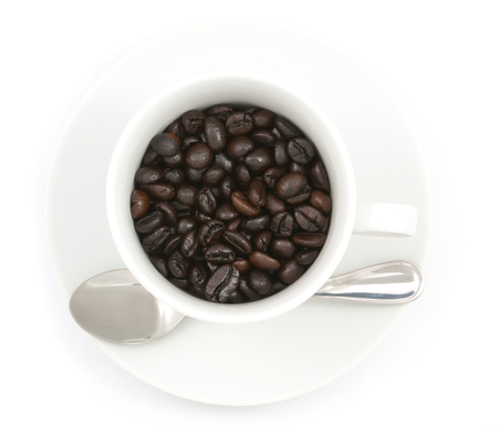 Coffee beans in the cup isolated on white backgroundの写真素材