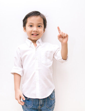 kid asia boy showing the number one with handの写真素材