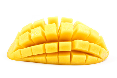mango slice cut to cubes close up isolated on white backgroundの写真素材