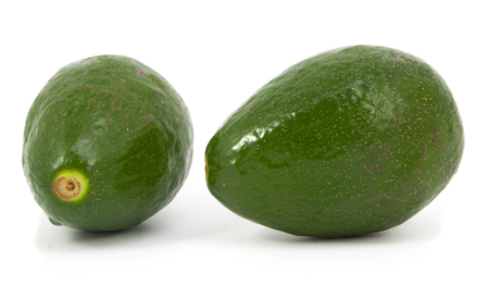two ripe avocados isolated on a white backgroundの写真素材