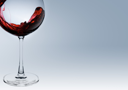 wine being pouring into a glass closeup wine splashing splashの写真素材