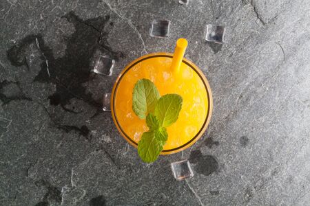 oranges and juice on stone table top view copy spaceの写真素材