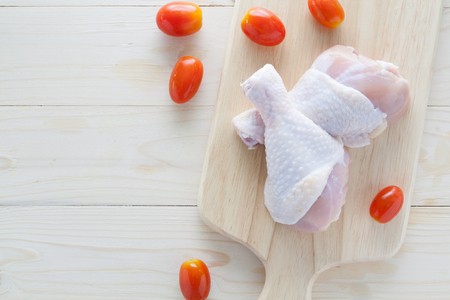 raw chicken breast fillets on wooden backgroundの写真素材