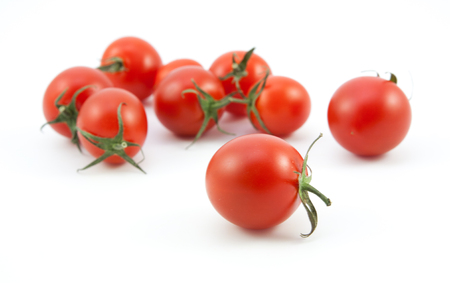 organic red tomatoes on white backgroundの写真素材