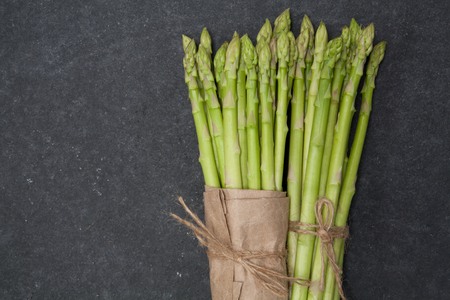 bunch of asparagus over slate backgroundの写真素材