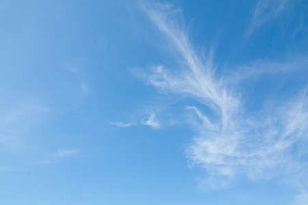 blue sky background with tiny clouds