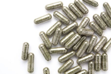 herb capsule  on white backgroundの写真素材